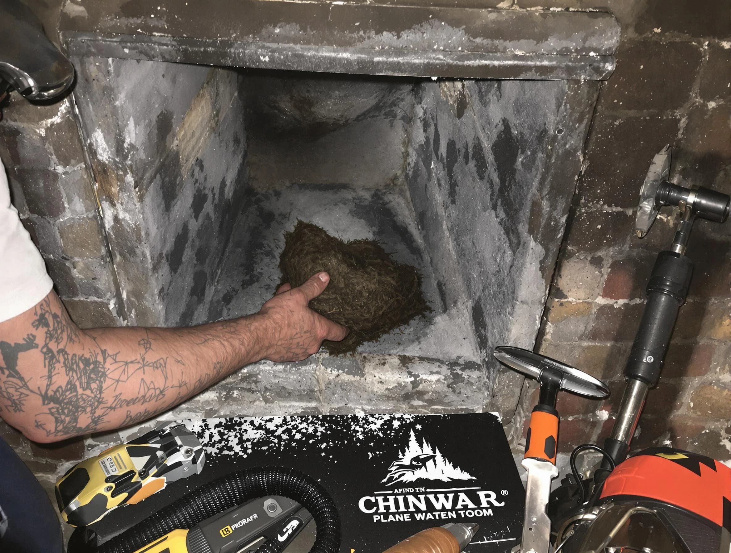 South Jordan Chimney Sweep safely removing debris and screening chimney in South Jordan, UT